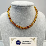 Bebek Şifa Kaynağı Orijinal Sertifikalı Şeffaf Turuncu Damla Kehribar Kolye